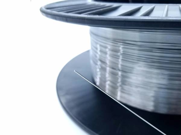 A coil of archwire on the white background.