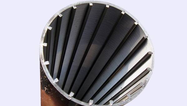 A hand is holding a wedge wire screen tube with wedge wire as support rod.